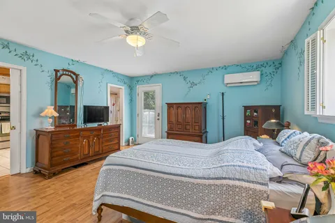 a bedroom with a bed and a dresser