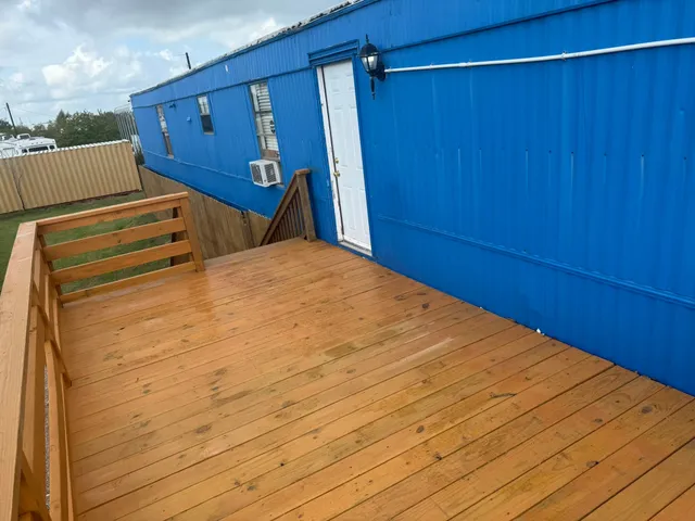 a view of a room with wooden walls