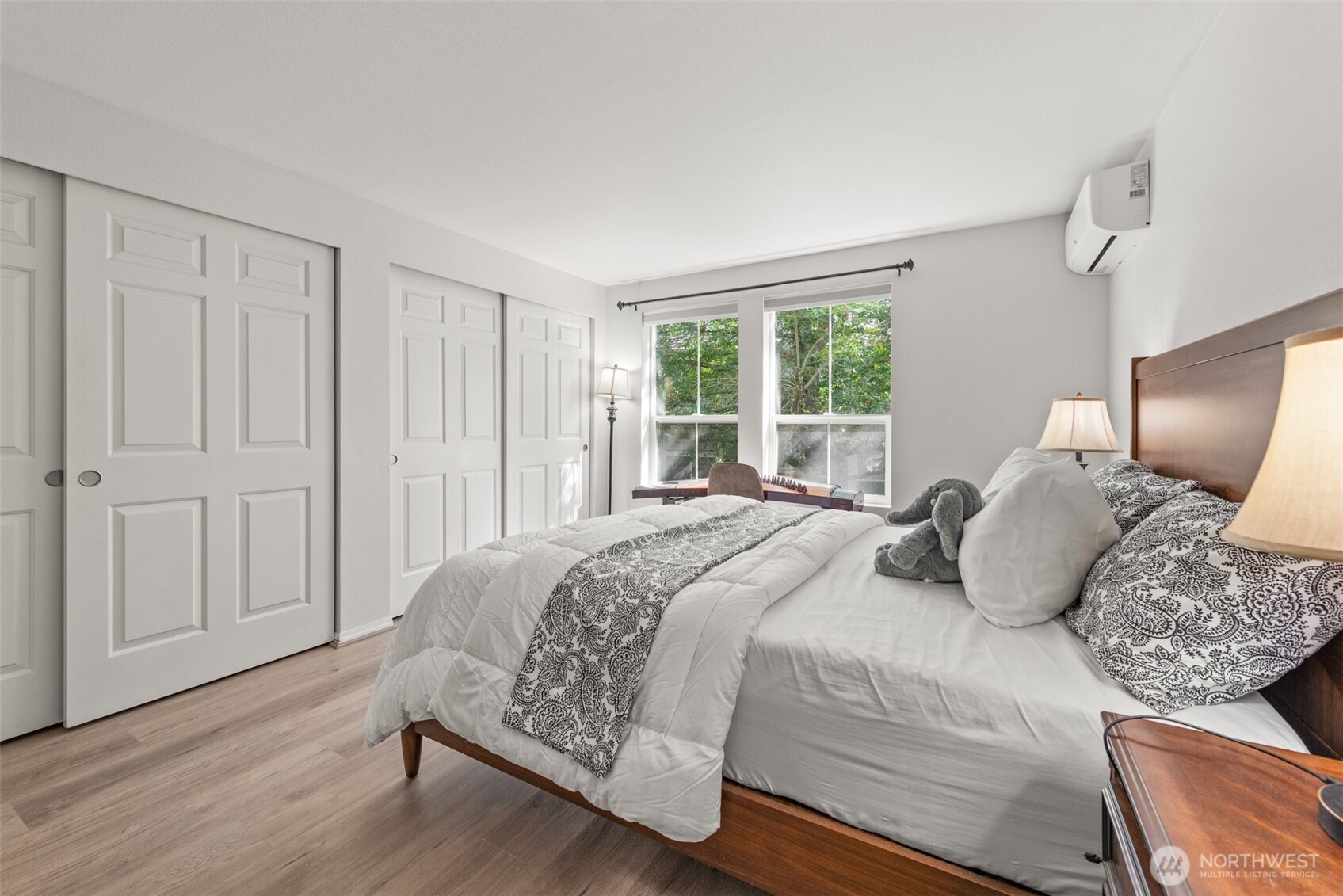 4423 249th Terrace Southeast Issaquah, WA 98029 - Photo 11 of 27 a bedroom with a large bed and wooden floor
