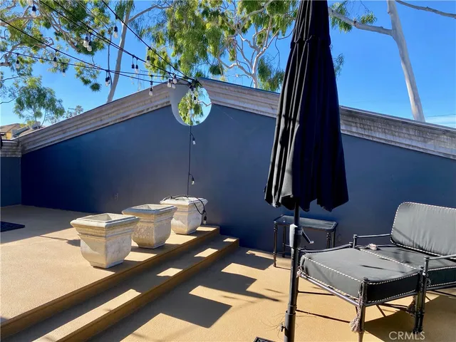 a wooden bench sitting in front of a building