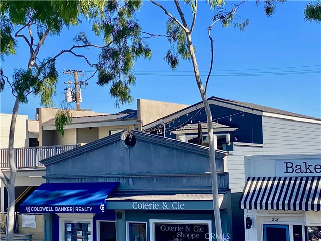 a view of a house with a tree