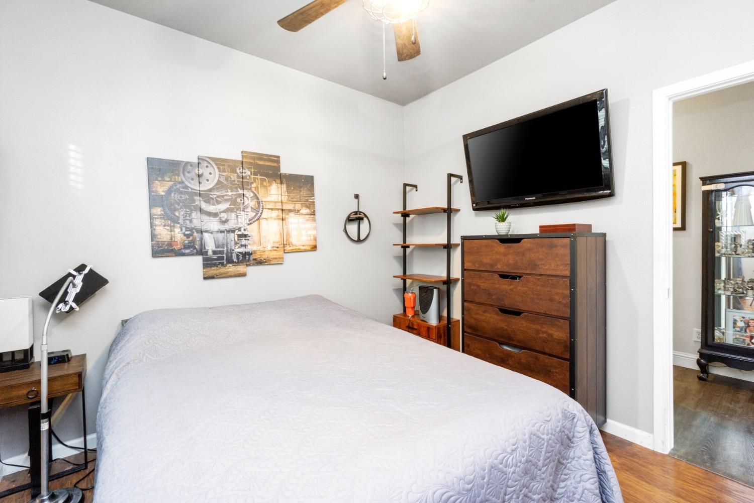 2658 Kimberly Drive Madera, CA 93637 - Photo 20 of 27 a bedroom with a bed and a flat screen tv