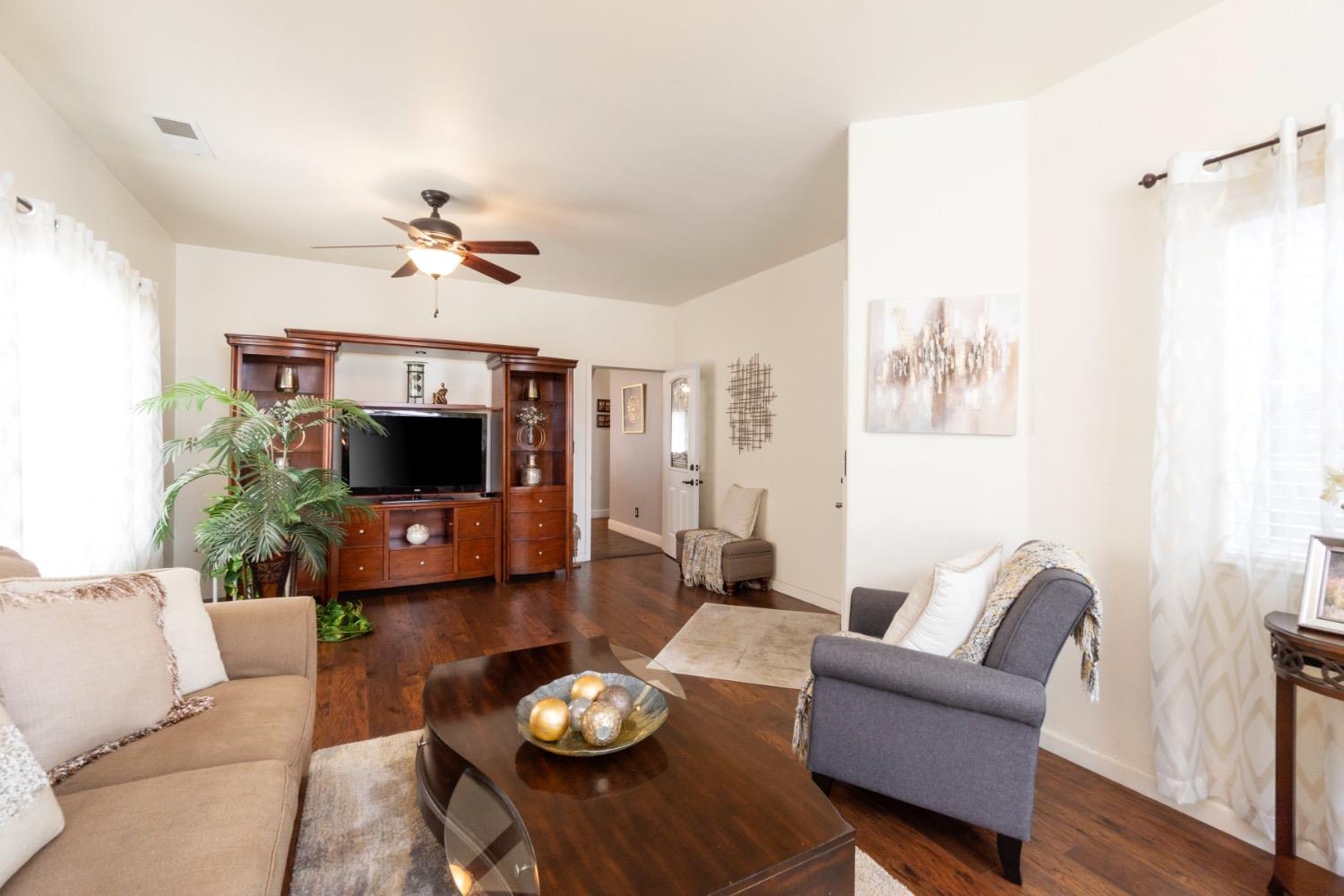 2658 Kimberly Drive Madera, CA 93637 - Photo 6 of 27 a living room with furniture and a flat screen tv