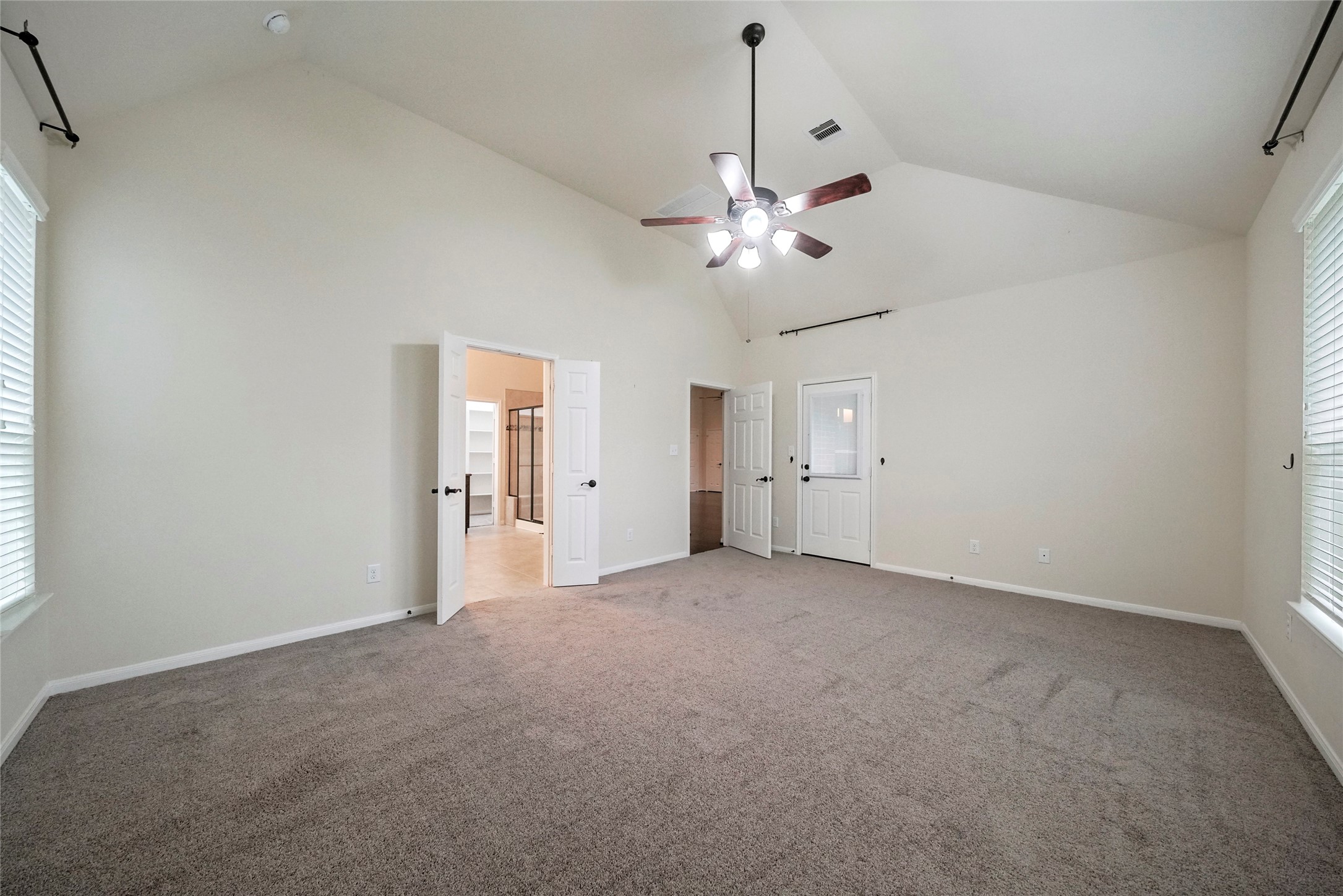 8132 Tranquil Lake Way Conroe, TX 77385 - Photo 11 of 32 Large primary suite with vaulted ceilings