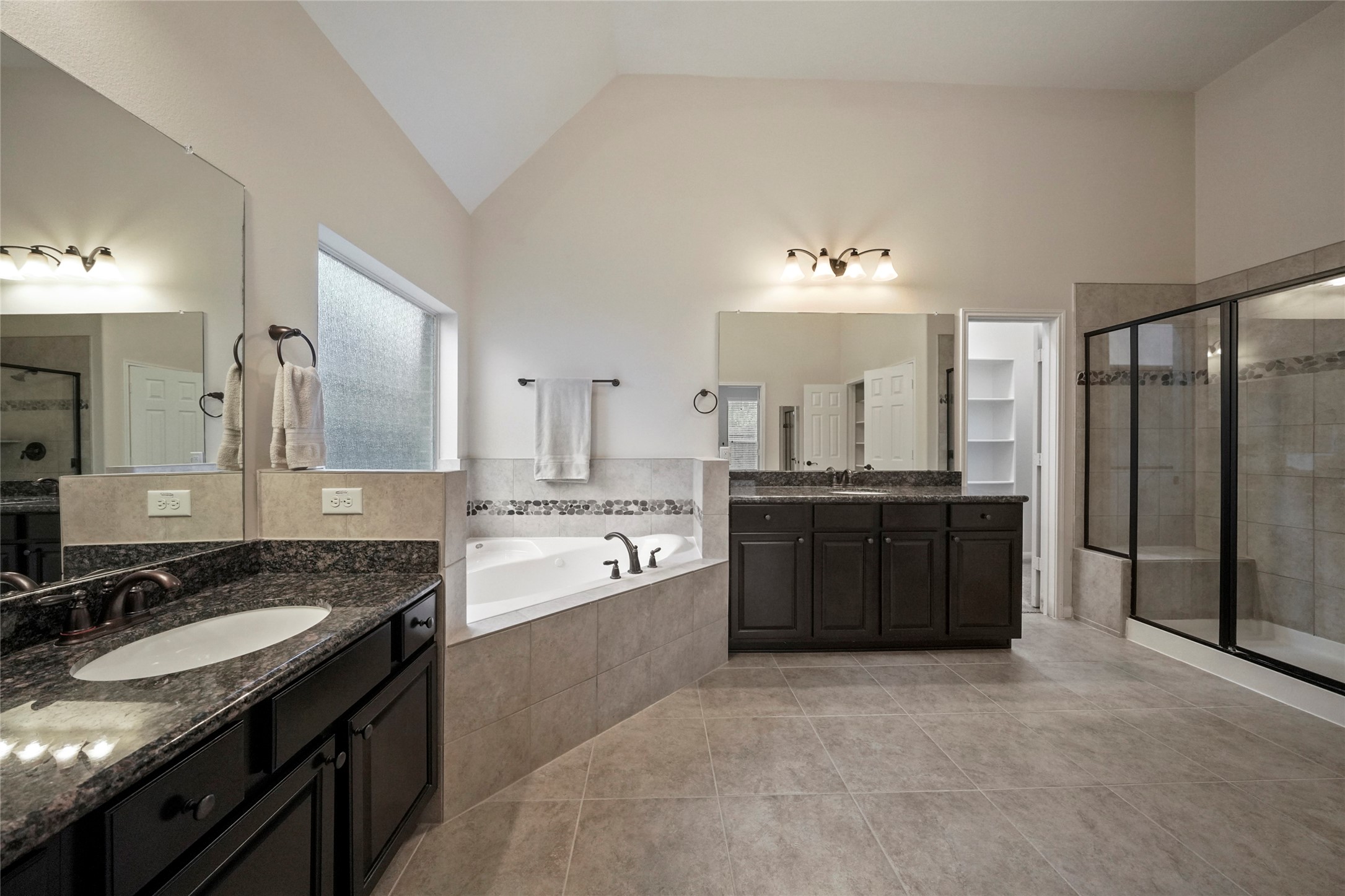 8132 Tranquil Lake Way Conroe, TX 77385 - Photo 12 of 32 Fabulous owners retreat with dual vanities, a garden tub & a walk in shower.