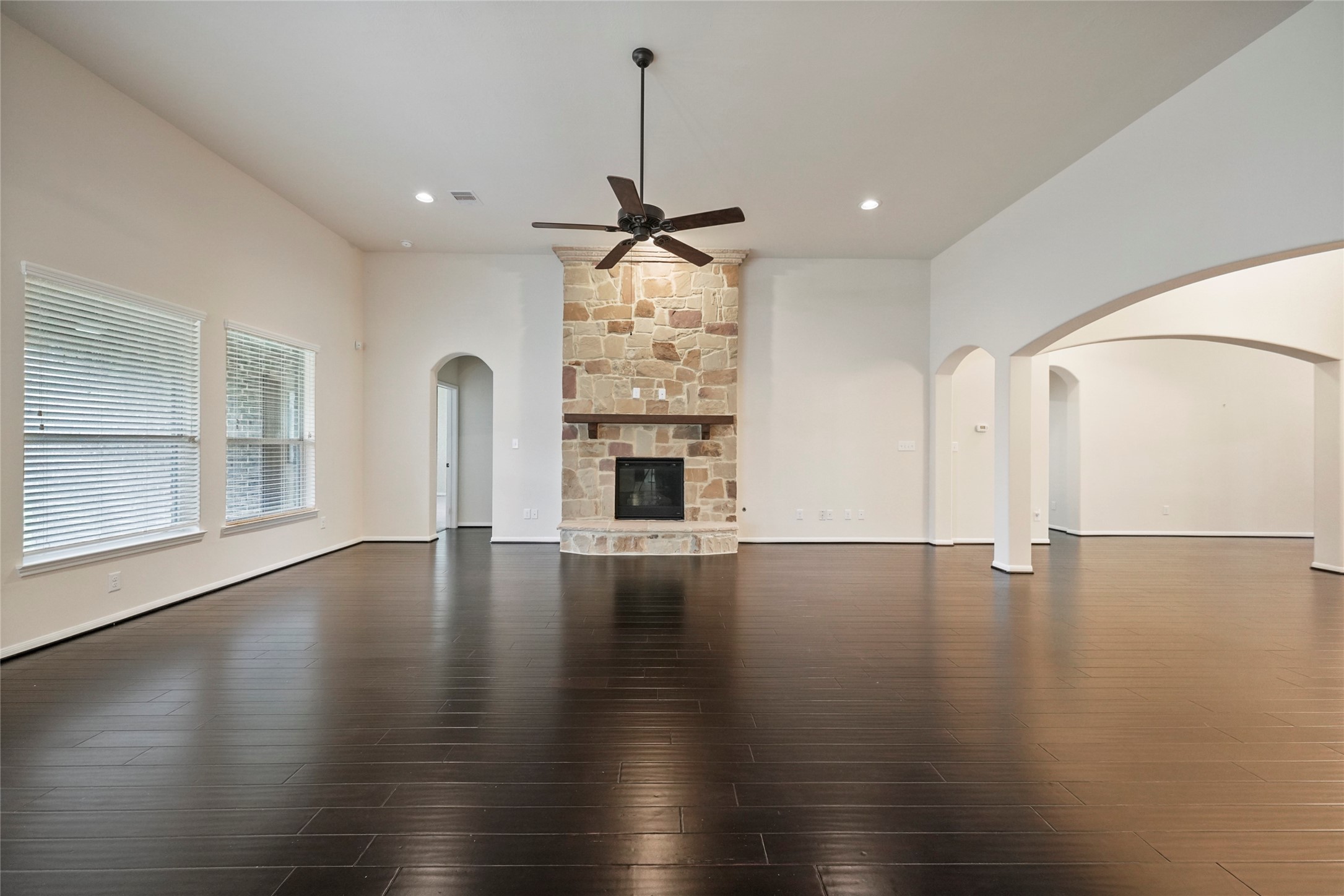 8132 Tranquil Lake Way Conroe, TX 77385 - Photo 4 of 32 There is a gas fireplace in the living room and recessed lighting throughout the home.