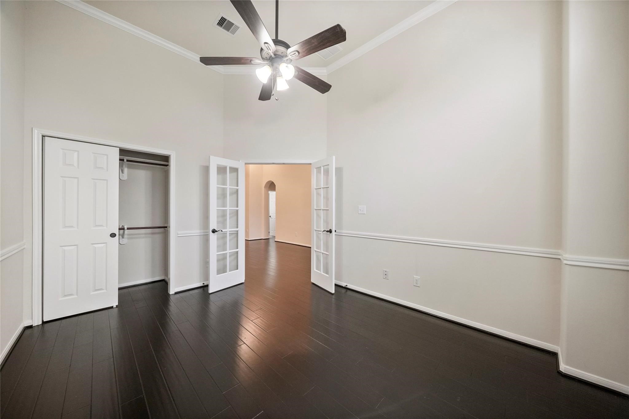 8132 Tranquil Lake Way Conroe, TX 77385 - Photo 9 of 32 The home office has French doors for privacy and gorgeous wood floors.