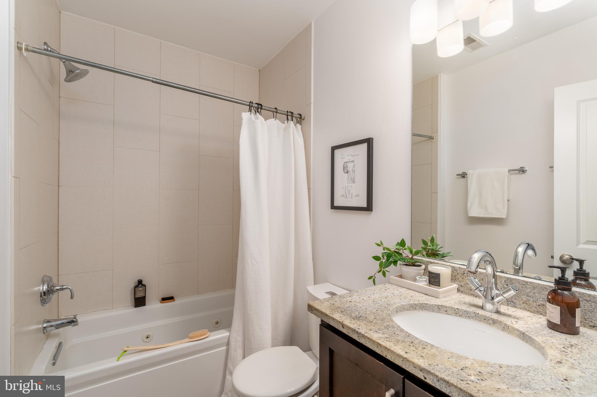 3465 14th Street Northwest, Unit D Washington, DC 20010 - Photo 12 of 24 a bathroom with a granite countertop sink toilet and shower