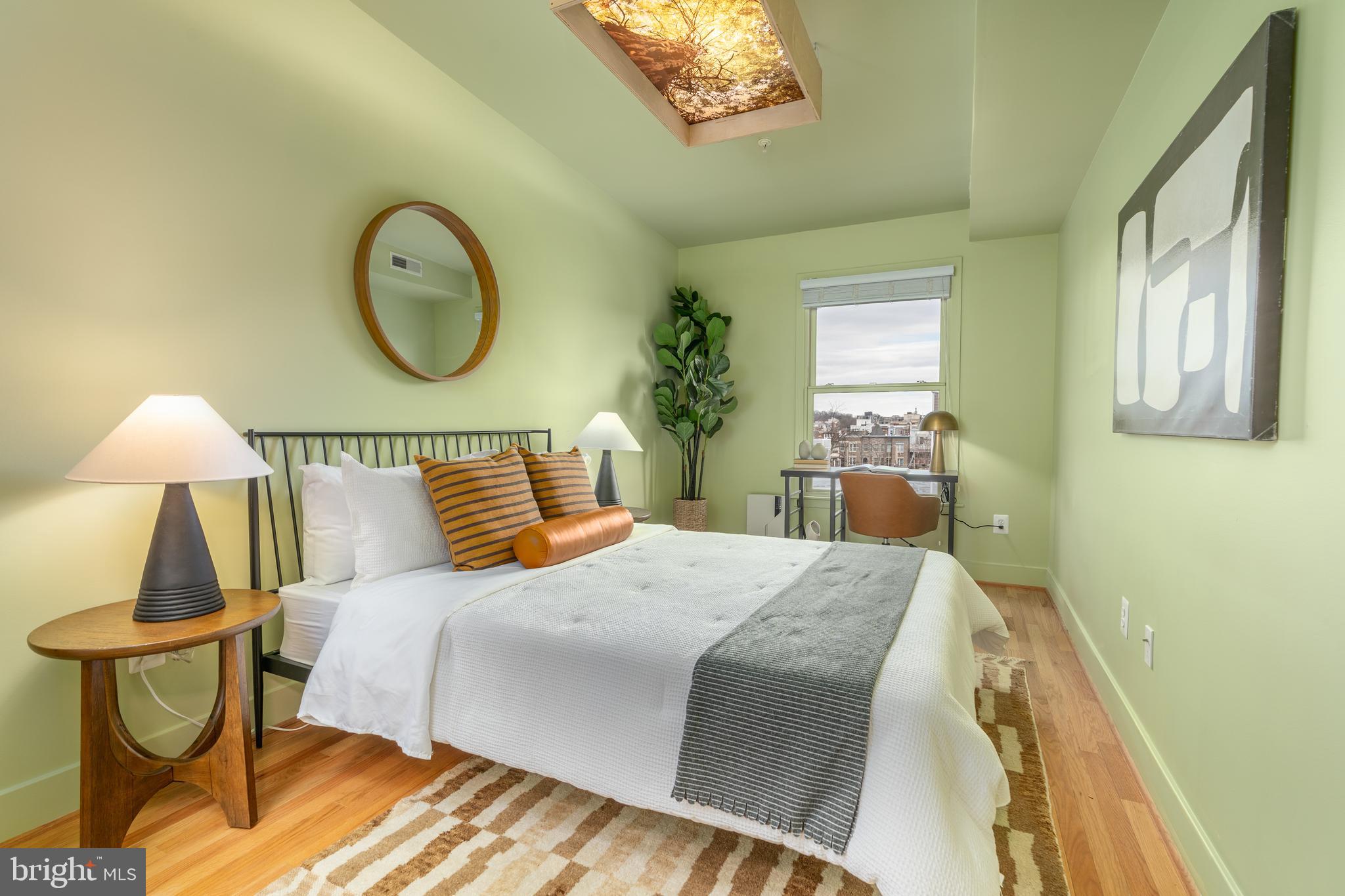 3465 14th Street Northwest, Unit D Washington, DC 20010 - Photo 13 of 24 a bedroom with a bed and dresser with mirror