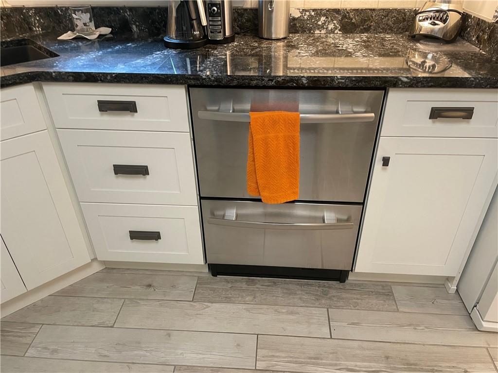 313 Pine Drive New Stanton, PA 15672 - Photo 16 of 41 a view of a refrigerator with white cabinets