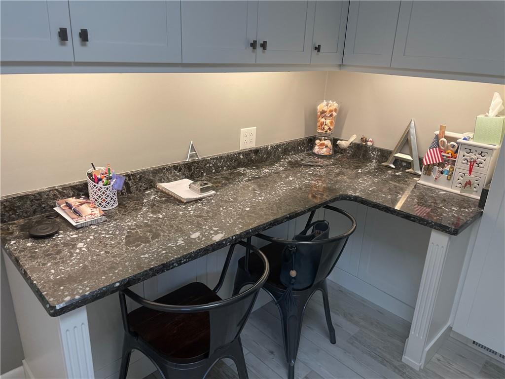 313 Pine Drive New Stanton, PA 15672 - Photo 17 of 41 a kitchen with a table chairs and cabinets