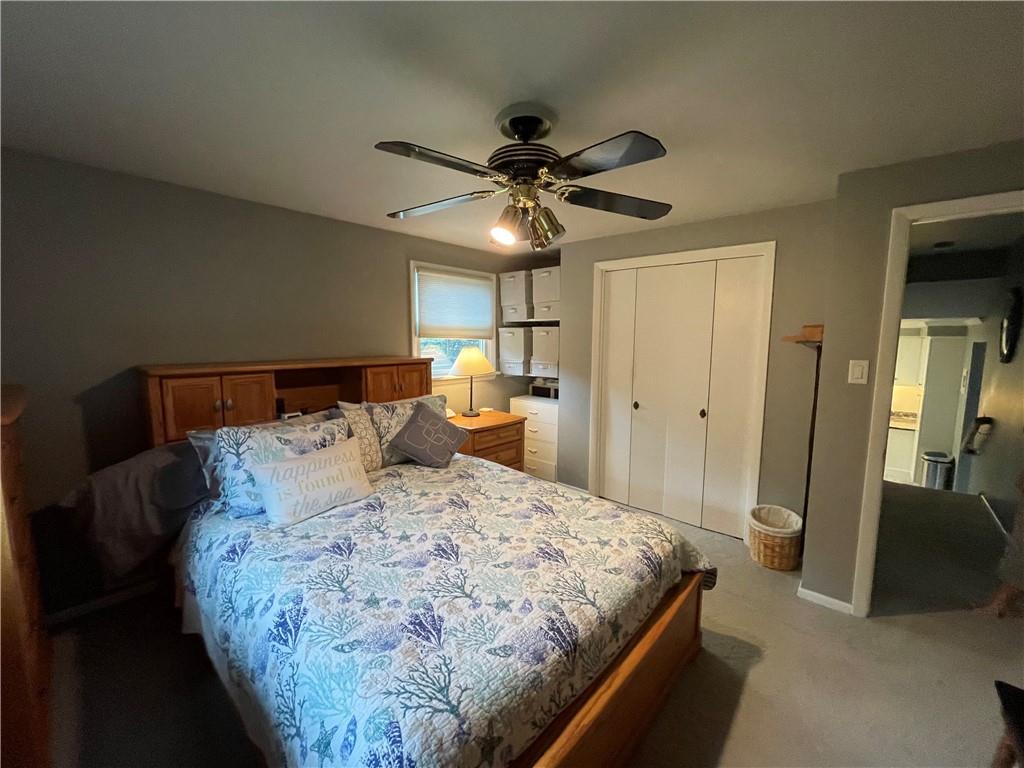 313 Pine Drive New Stanton, PA 15672 - Photo 22 of 41 a bedroom with a bed and a chandelier