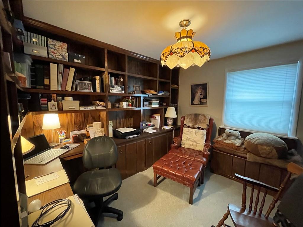 313 Pine Drive New Stanton, PA 15672 - Photo 27 of 41 a living room with furniture and a chandelier