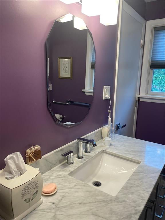 313 Pine Drive New Stanton, PA 15672 - Photo 30 of 41 a bathroom with a granite countertop sink and a mirror