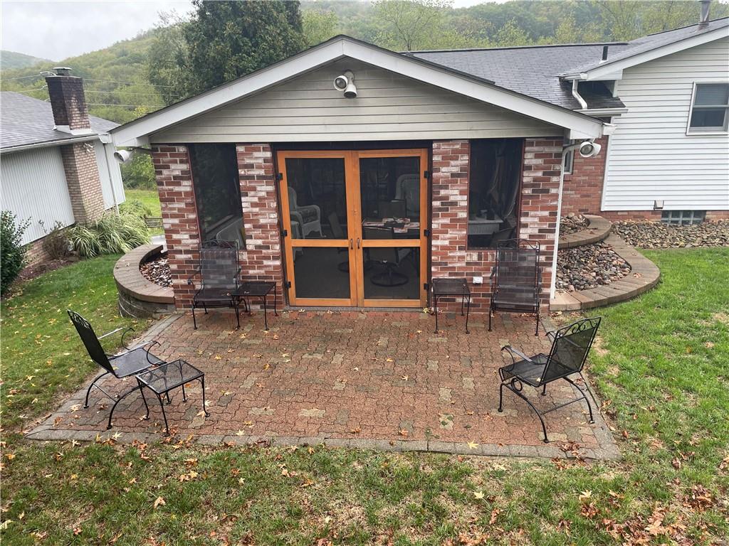 313 Pine Drive New Stanton, PA 15672 - Photo 3 of 41 a front view of a house with garden