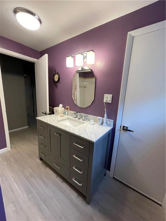 313 Pine Drive New Stanton, PA 15672 - Photo 32 of 41 a bathroom with a double vanity sink and mirror