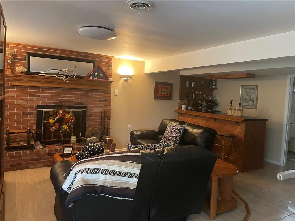 313 Pine Drive New Stanton, PA 15672 - Photo 35 of 41 a living room with furniture and a fireplace