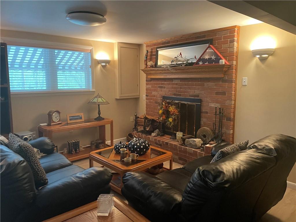 313 Pine Drive New Stanton, PA 15672 - Photo 37 of 41 a living room with furniture and a fireplace