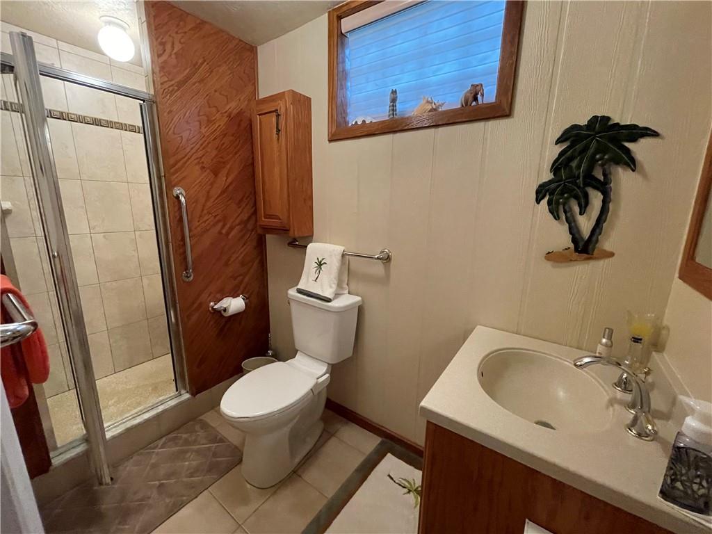 313 Pine Drive New Stanton, PA 15672 - Photo 39 of 41 a white toilet sitting next to a bathroom sink