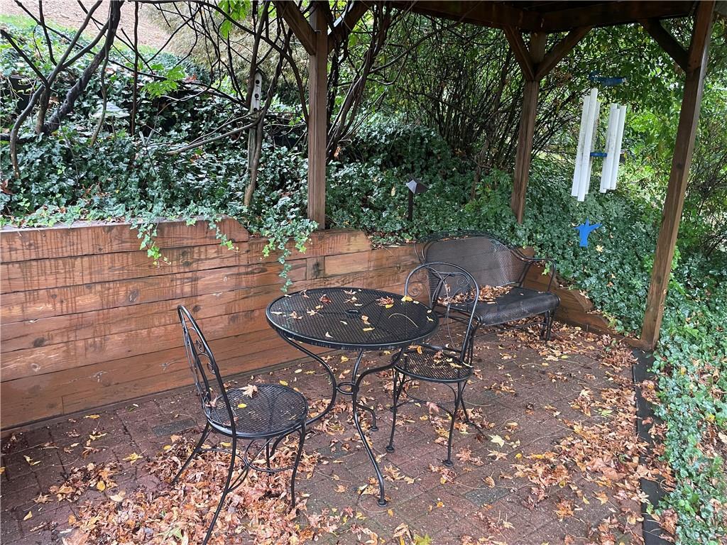 313 Pine Drive New Stanton, PA 15672 - Photo 6 of 41 a view of an outdoor space with table and chairs