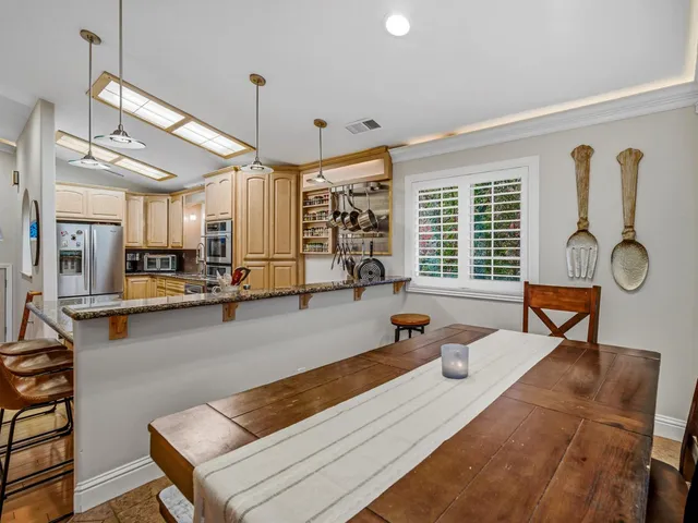 a living room with furniture a window and gym equipment