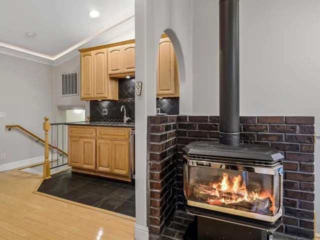 a kitchen with stainless steel appliances a stove and a microwave
