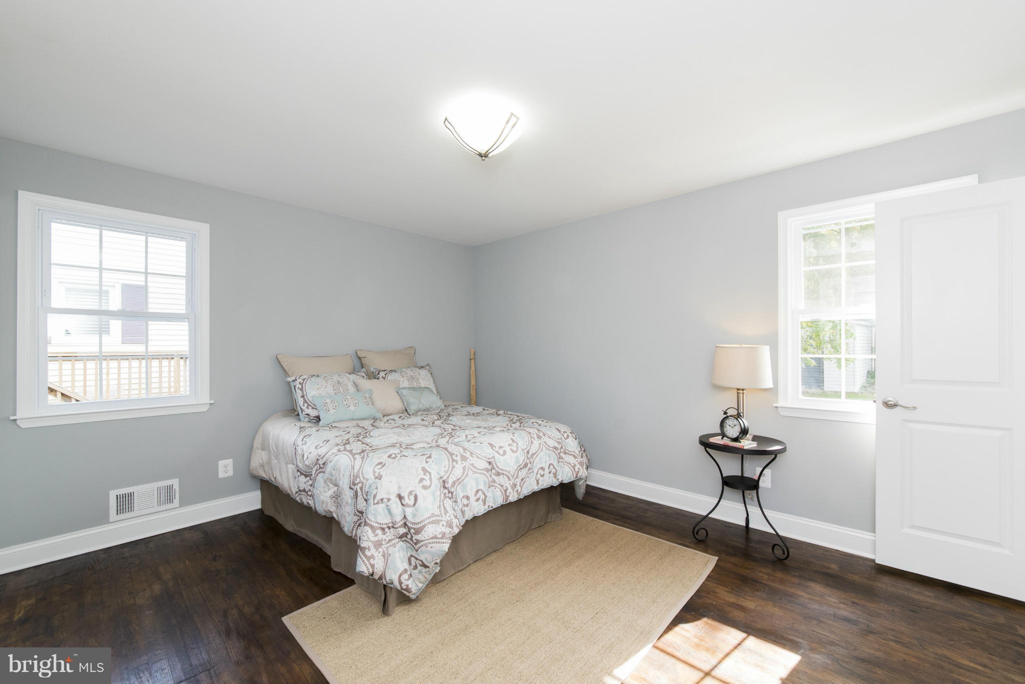 6705 Fordcrest Road Baltimore, MD 21237 - Photo 14 of 30 a room with a bed and a table