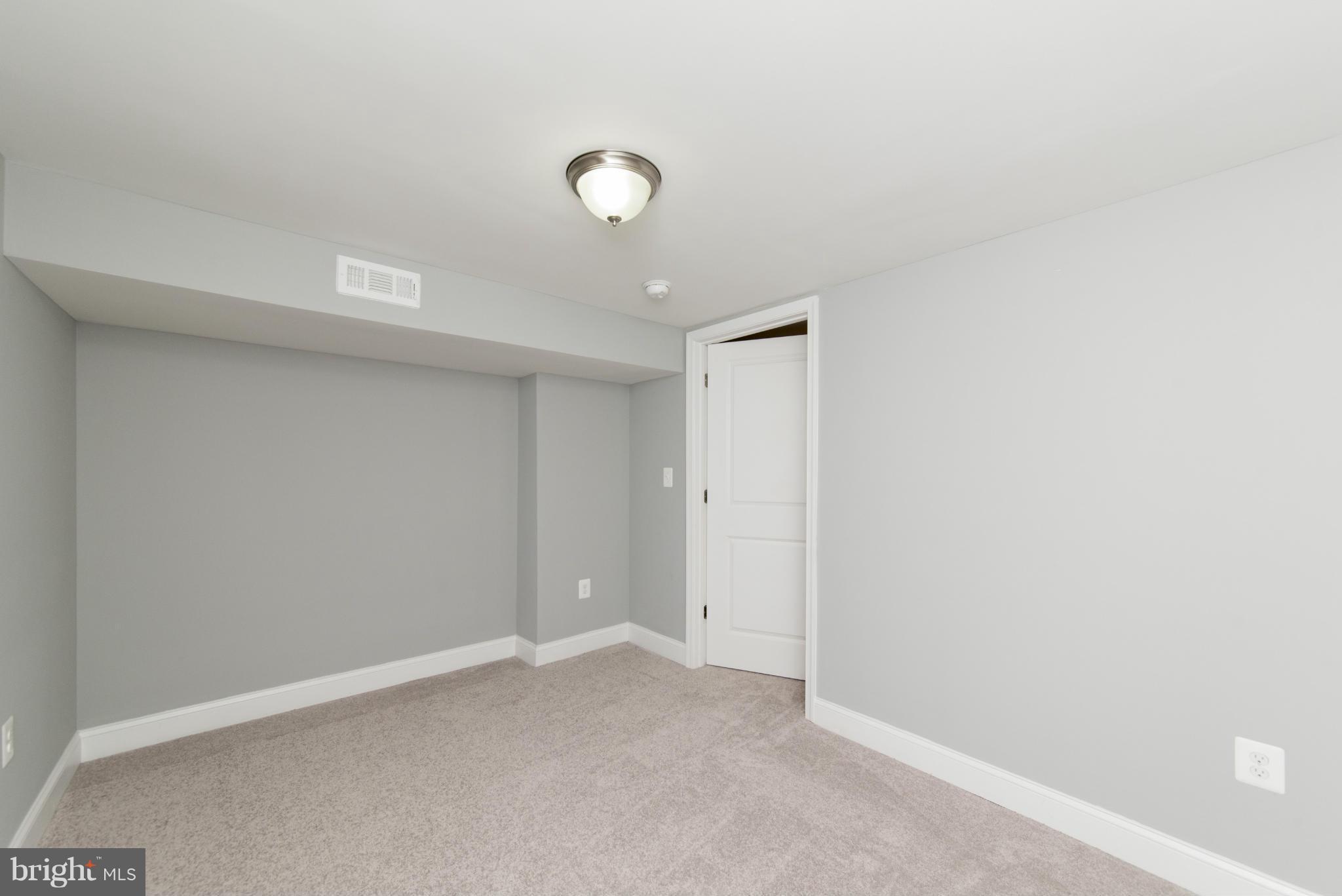 6705 Fordcrest Road Baltimore, MD 21237 - Photo 27 of 30 an empty room with a empty space and a window