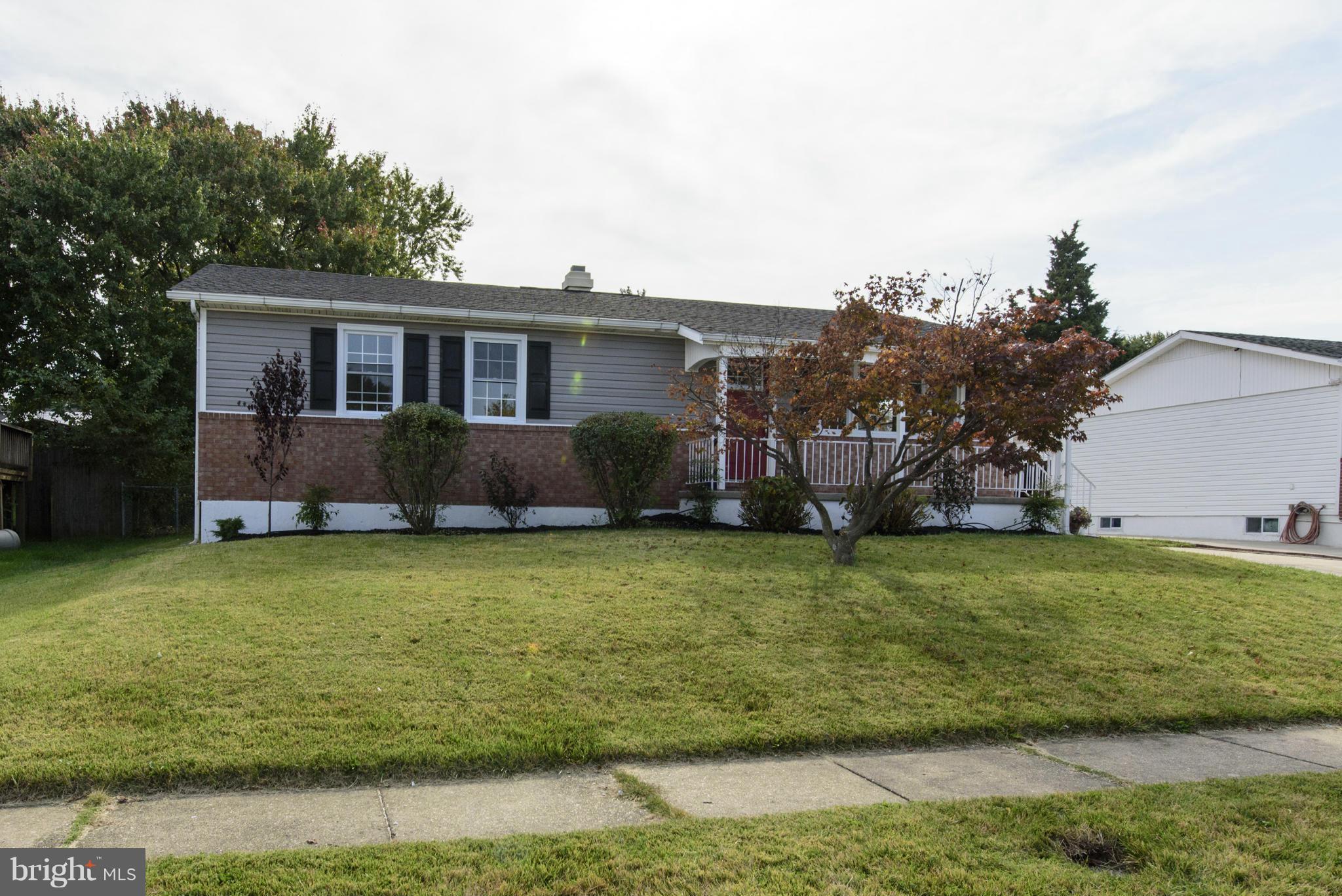 6705 Fordcrest Road Baltimore, MD 21237 - Photo 29 of 30 a front view of a house with garden