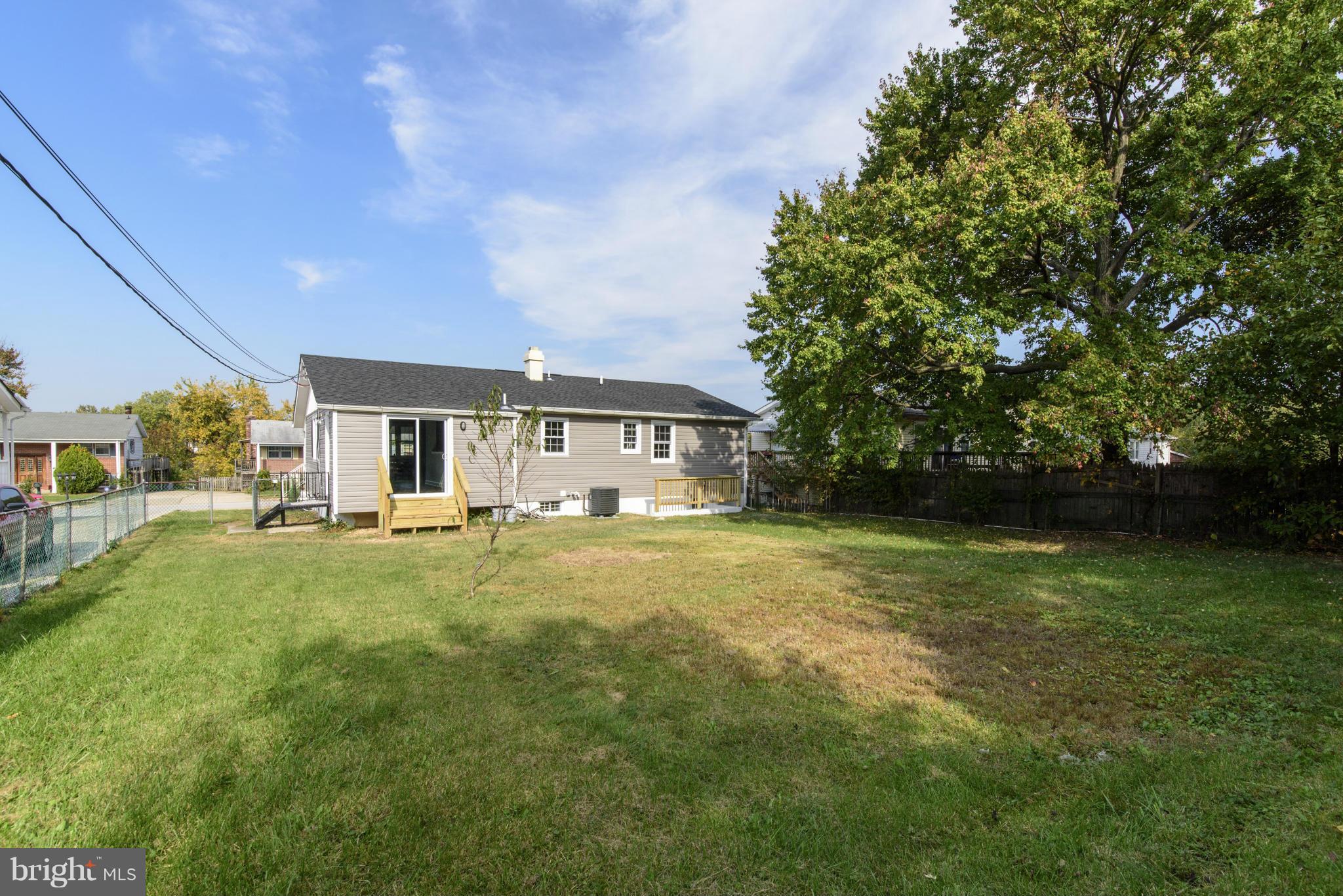 6705 Fordcrest Road Baltimore, MD 21237 - Photo 30 of 30 a front view of a house with a garden