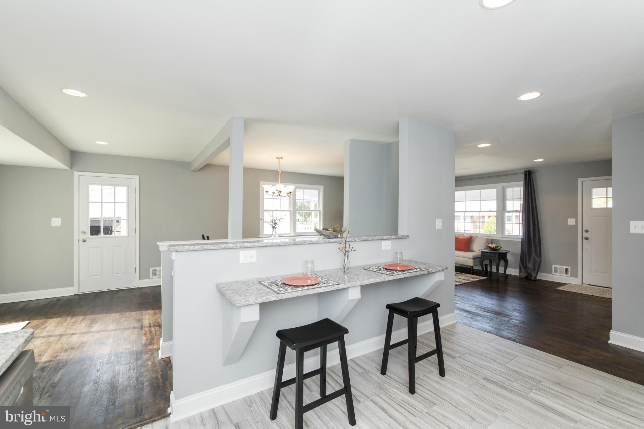 6705 Fordcrest Road Baltimore, MD 21237 - Photo 6 of 30 a view of a dining room with furniture and wooden floor