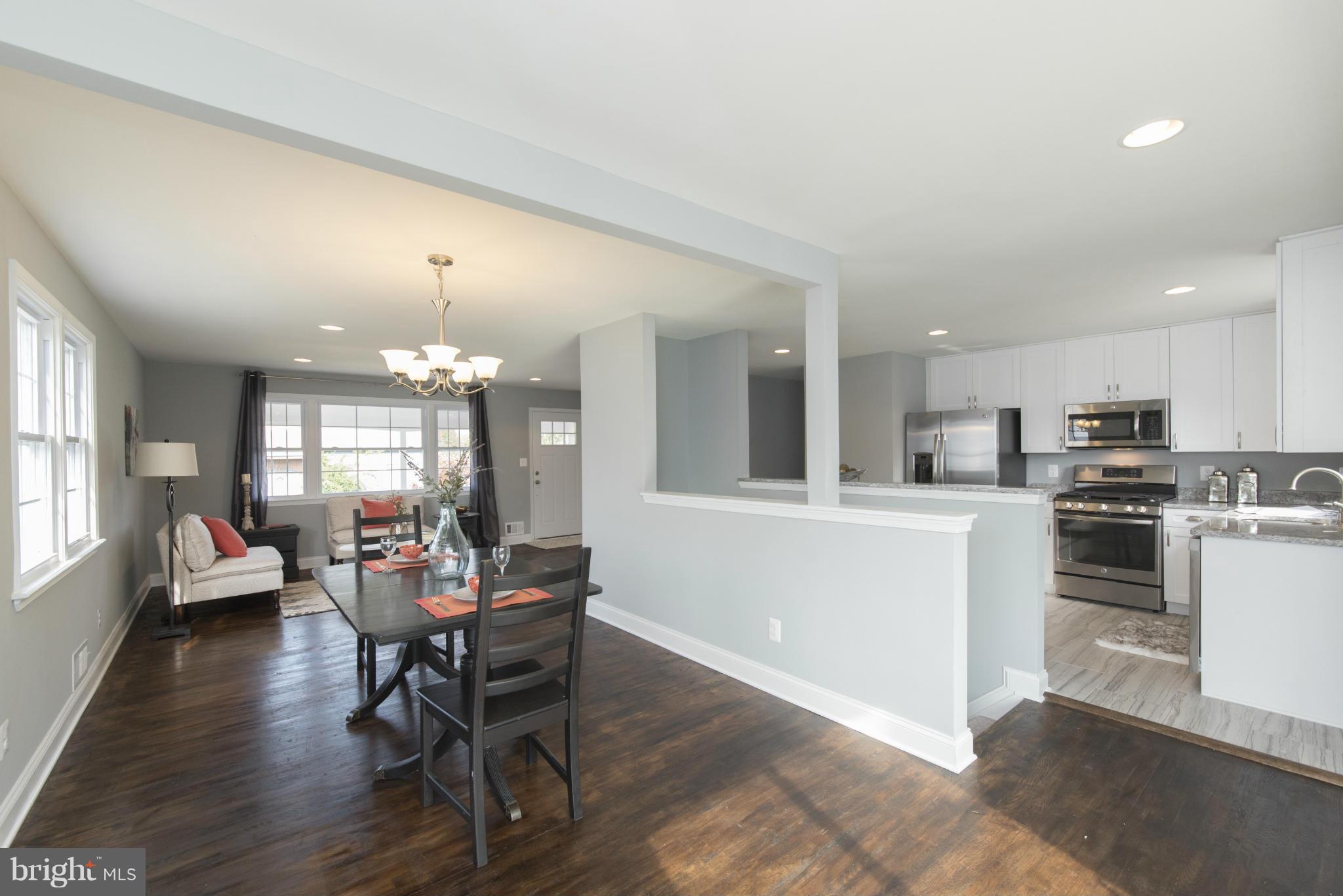 6705 Fordcrest Road Baltimore, MD 21237 - Photo 7 of 30 a view of a dining room with furniture and wooden floor