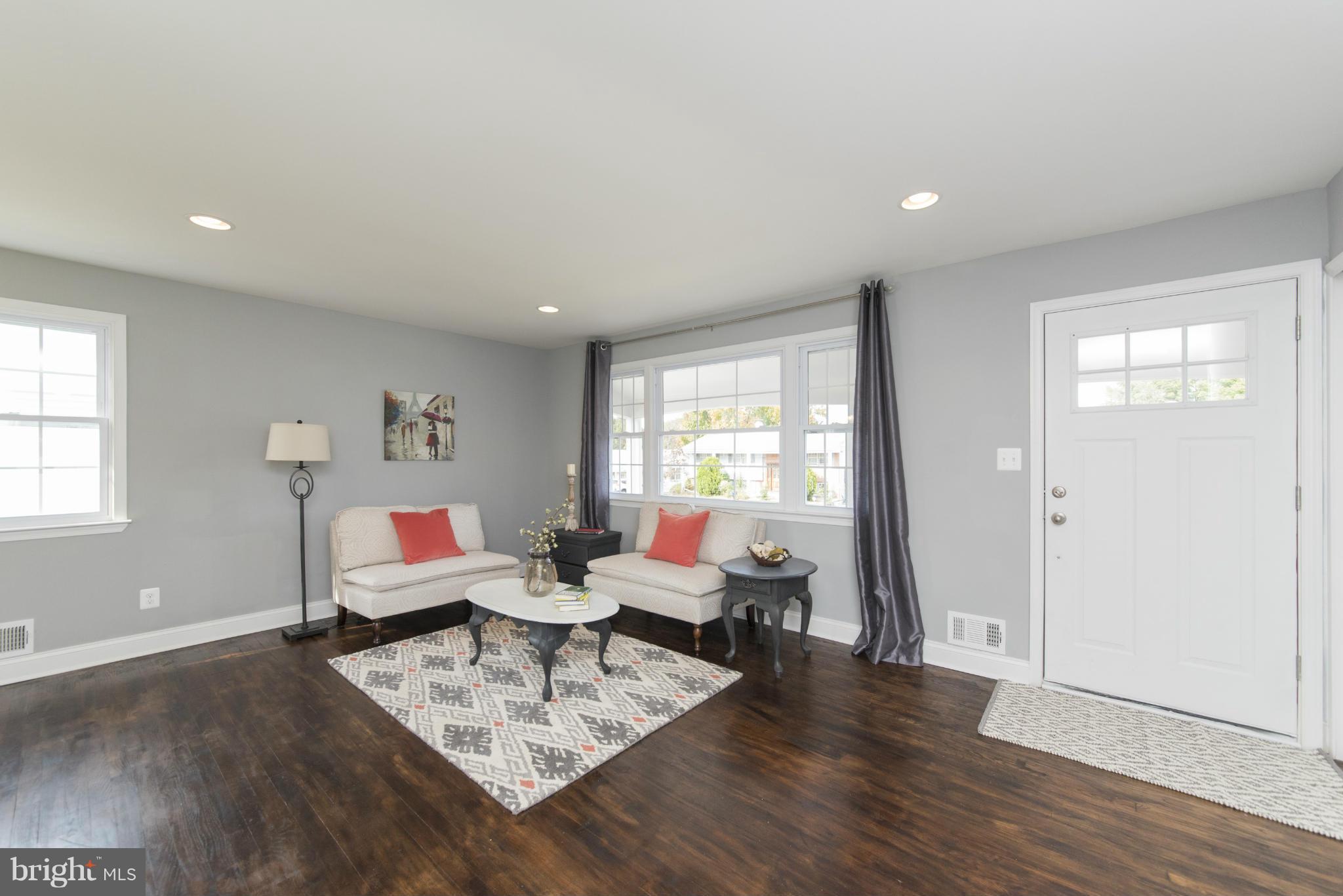 6705 Fordcrest Road Baltimore, MD 21237 - Photo 9 of 30 a living room with furniture and wooden floor
