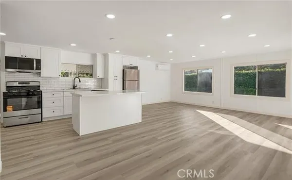 a view of kitchen with wooden floor