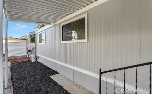 a view of a pathway both side of a house