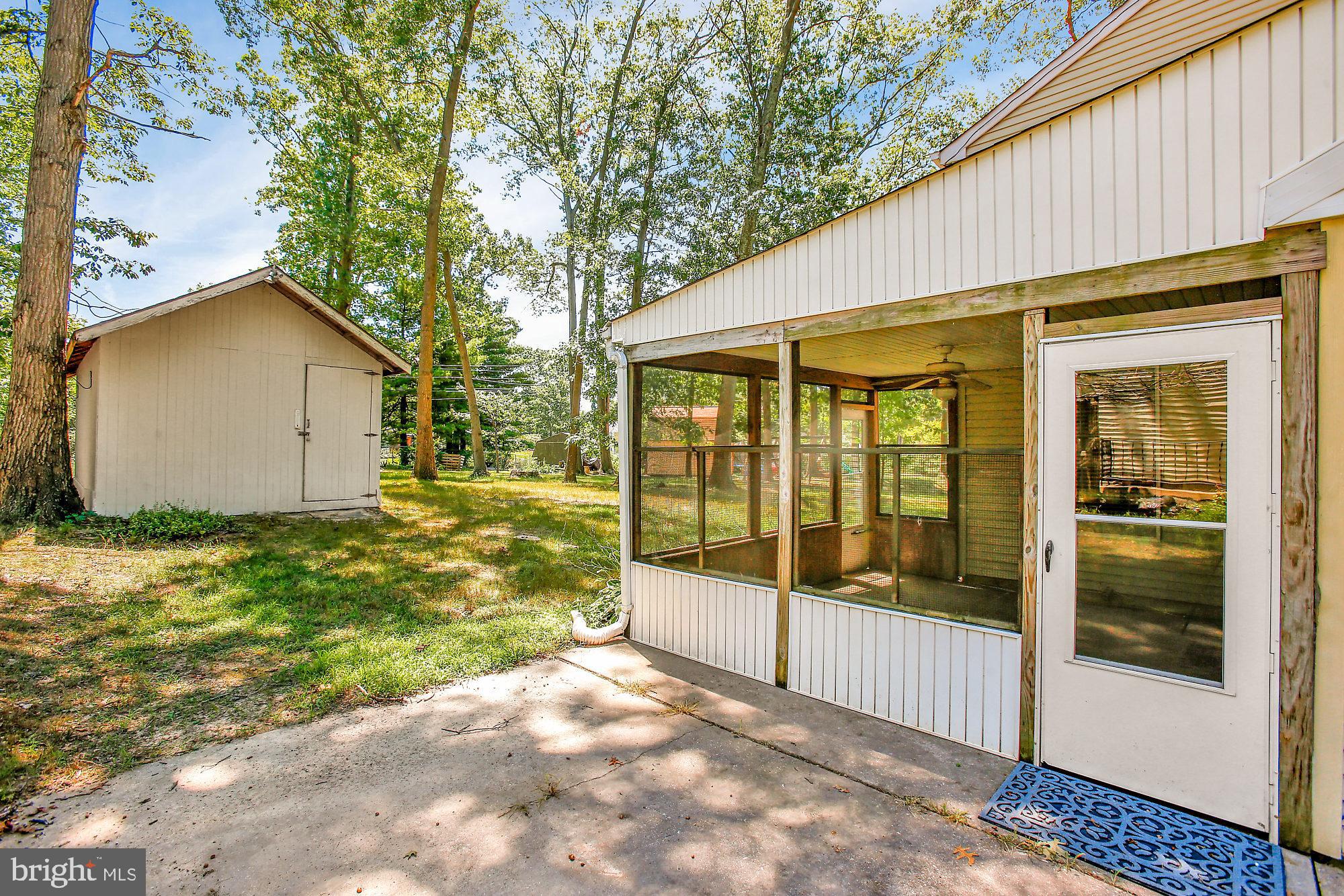 403 Trimble Road Joppa, MD 21085 - Photo 23 of 26 Screen porch. Large shed