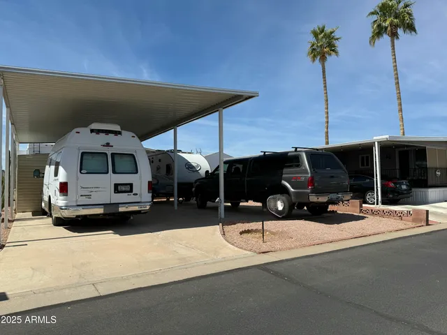 a view of a building with a cars park
