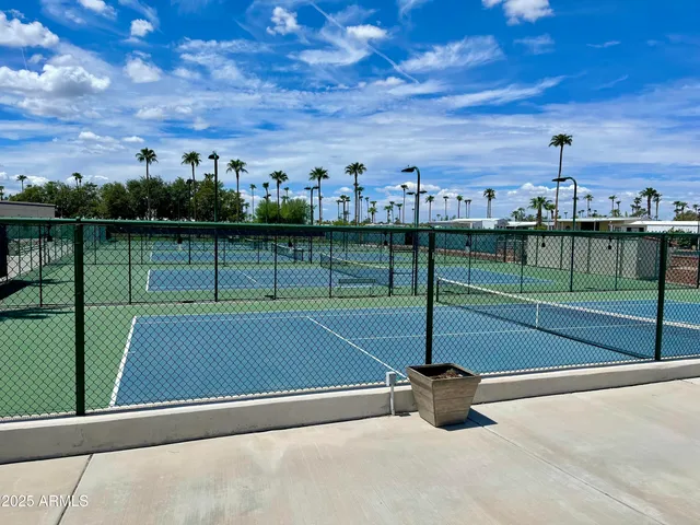 a view of a cafe with a table and chairs in the patio