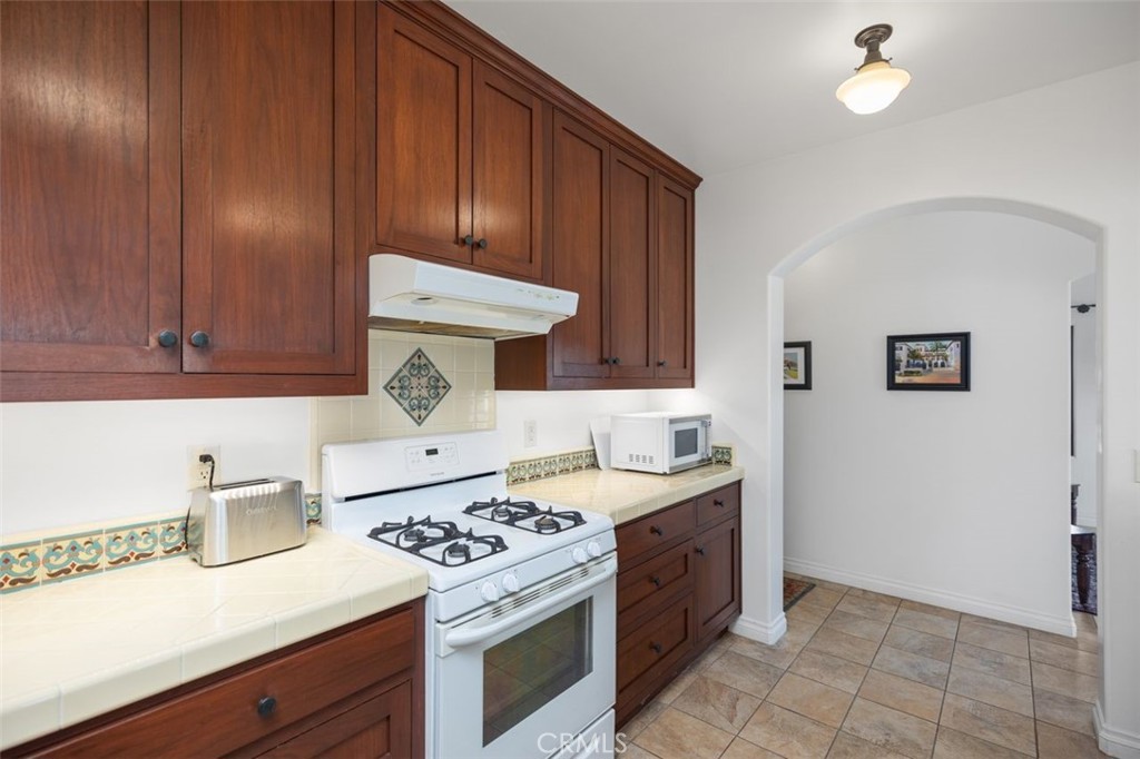 240 Avenida Rosa, Unit B San Clemente, CA 92672 - Photo 20 of 31 Kitchen looking towards hallway leading to bedroom and bathroom.