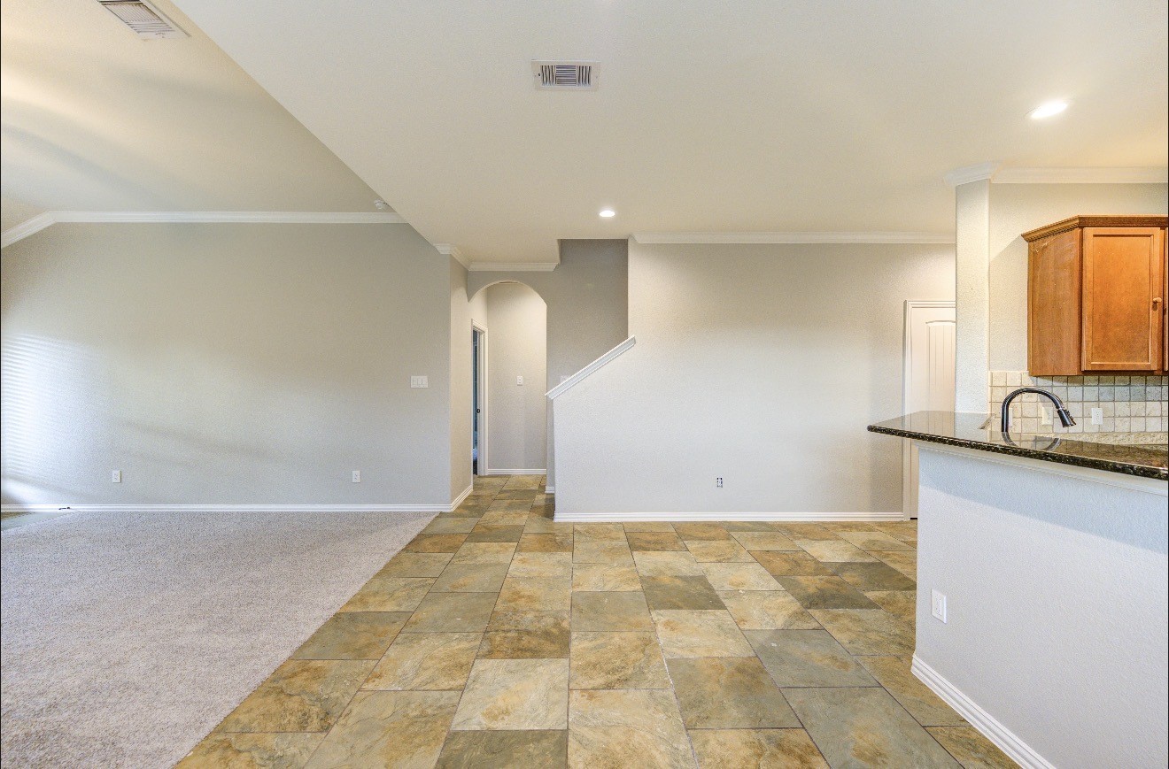 7 Maple Mill Court Conroe, TX 77301 - Photo 11 of 49 a view of a kitchen with a sink and a window