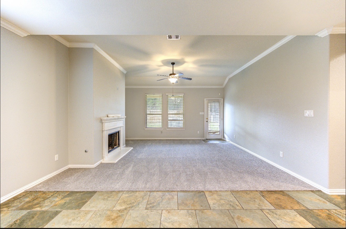 7 Maple Mill Court Conroe, TX 77301 - Photo 15 of 49 a view of a room with a fireplace