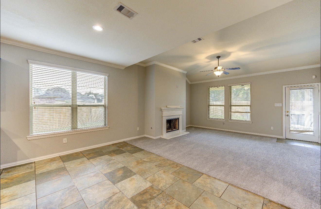 7 Maple Mill Court Conroe, TX 77301 - Photo 16 of 49 a view of an empty room with a window