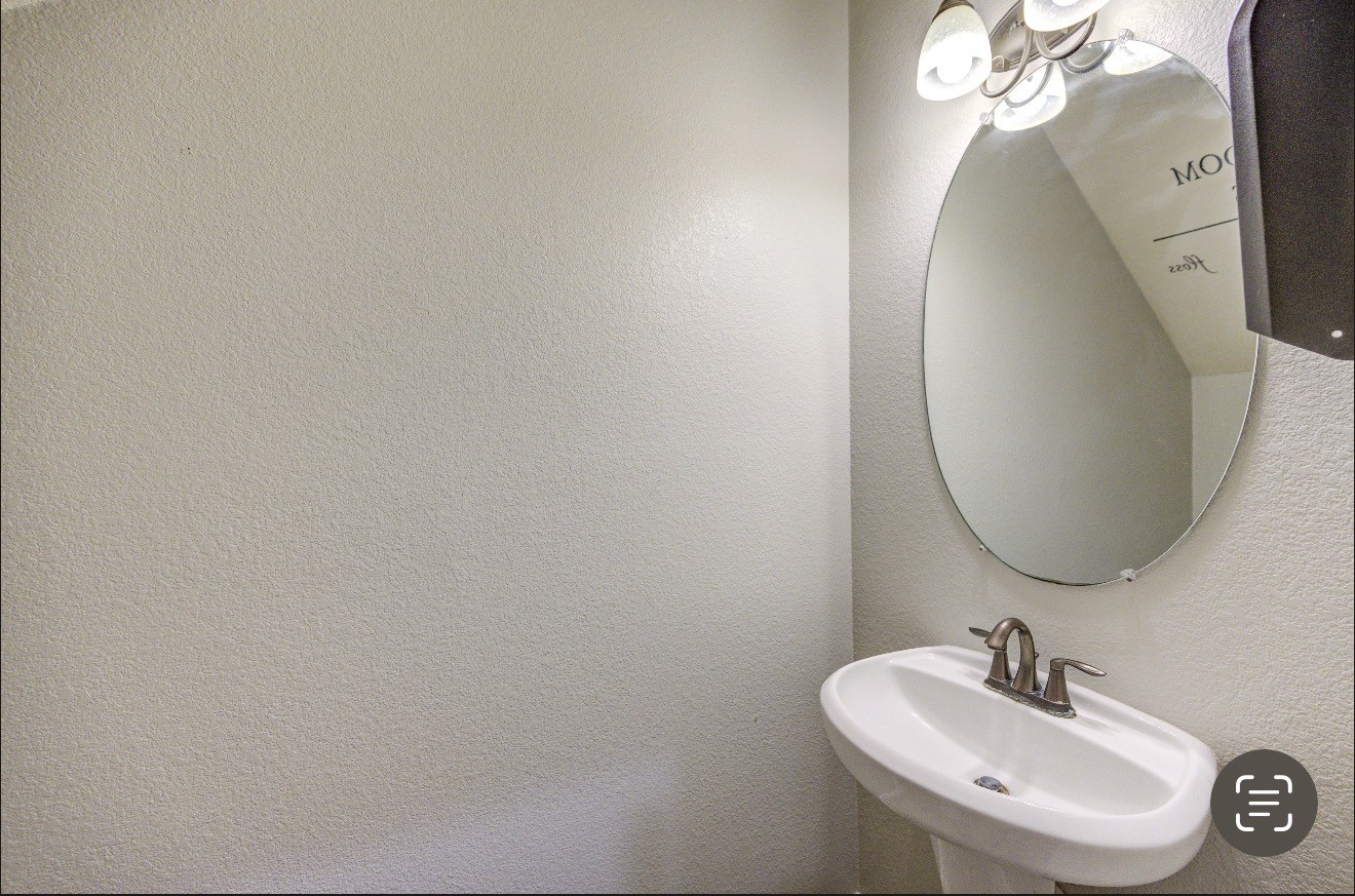7 Maple Mill Court Conroe, TX 77301 - Photo 23 of 49 a bathroom with a sink and a mirror