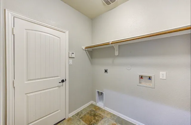 a view of a livingroom with a ceiling fan and window