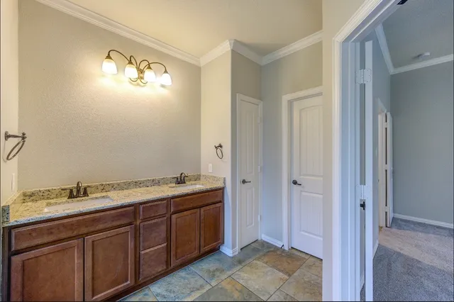 an empty room with closet and a ceiling fan