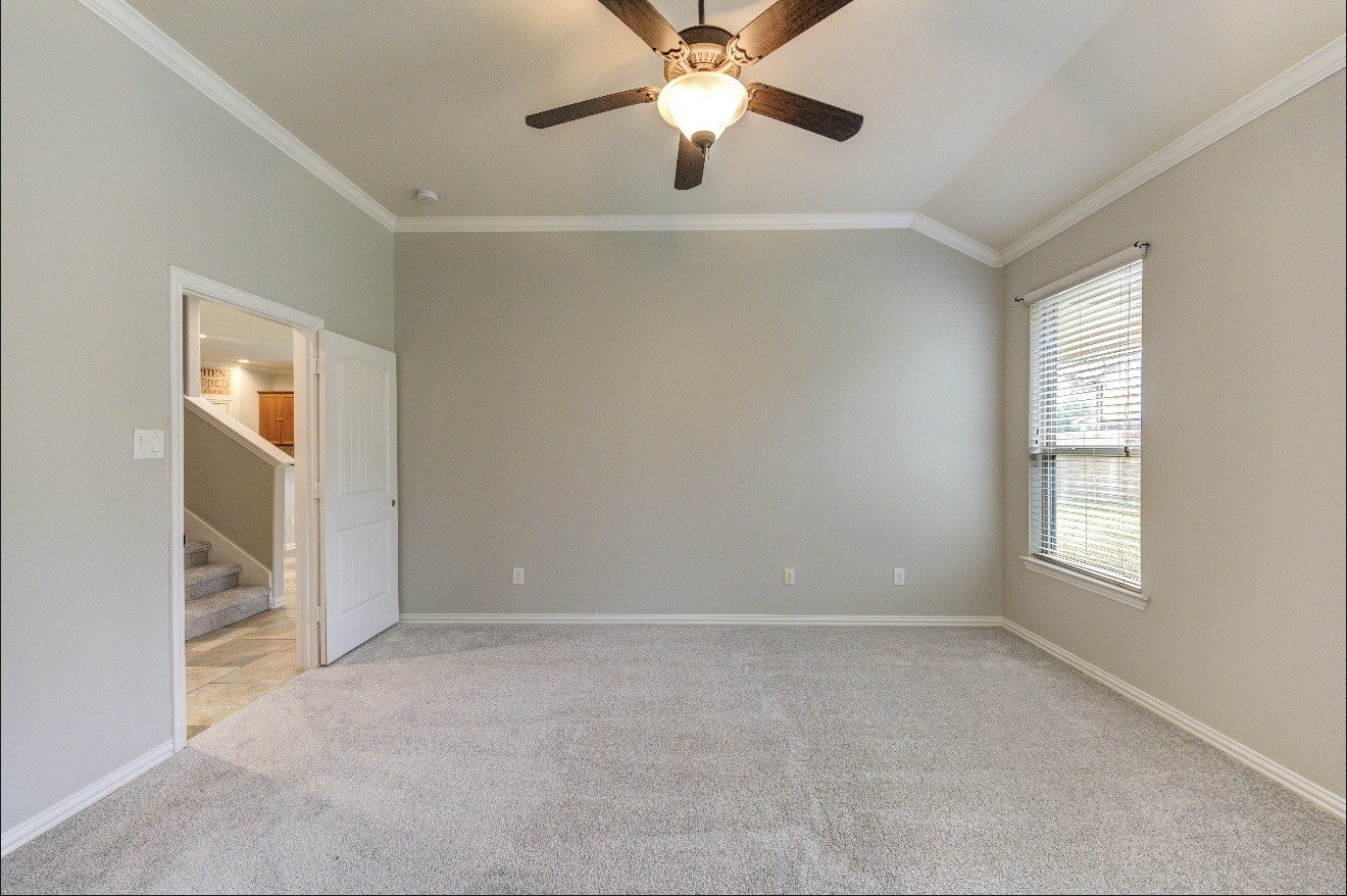 7 Maple Mill Court Conroe, TX 77301 - Photo 31 of 49 a view of an empty room with a window