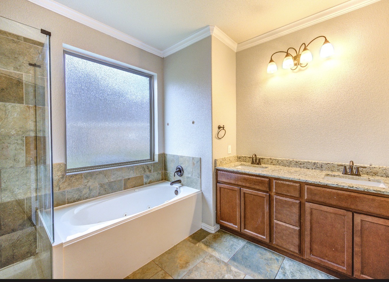7 Maple Mill Court Conroe, TX 77301 - Photo 32 of 49 a bathroom with a tub sink and mirror
