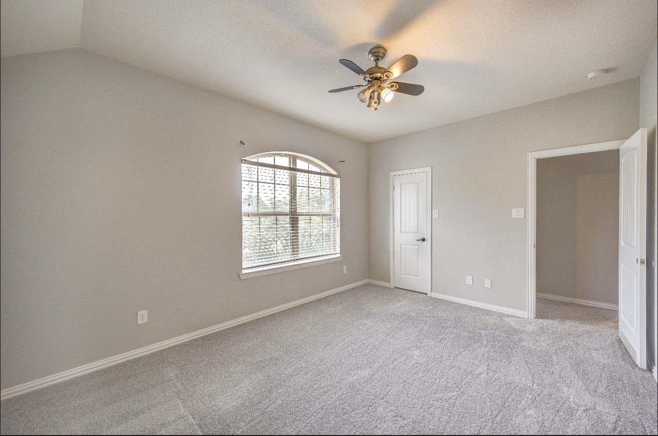 7 Maple Mill Court Conroe, TX 77301 - Photo 35 of 49 a view of an empty room with a window