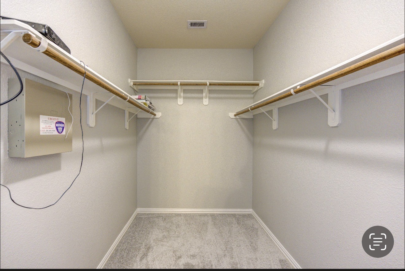 7 Maple Mill Court Conroe, TX 77301 - Photo 36 of 49 a view of a room with racks on the wall