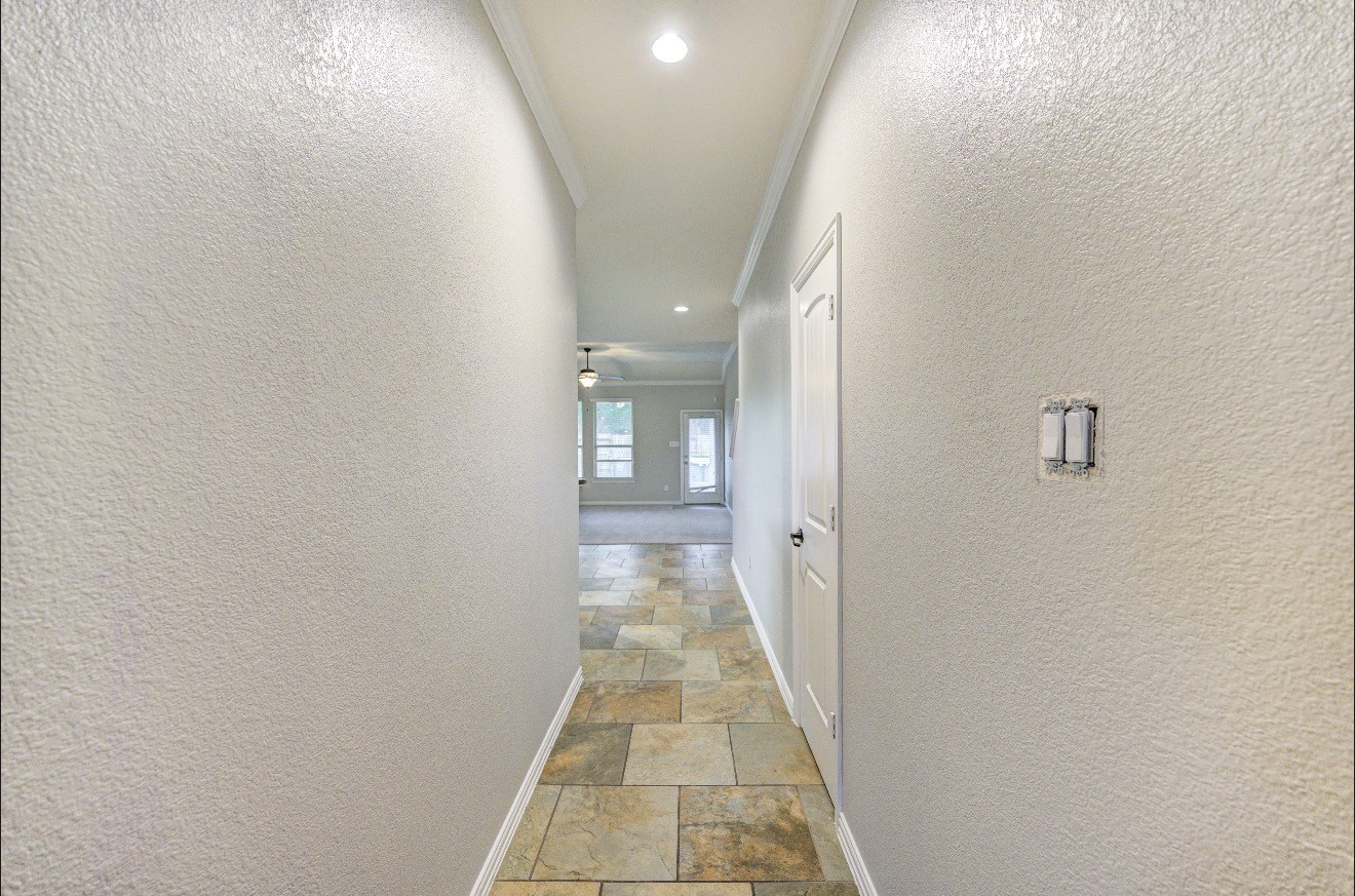 7 Maple Mill Court Conroe, TX 77301 - Photo 4 of 49 a view of a hallway